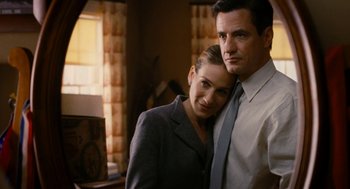 Movie still from “The Family Stone” (2005), directed by Thomas Bezucha – A man and a woman standing next to each other in a room; Close Up shot, Low angle
