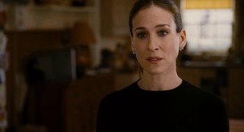 Movie still from “The Family Stone” (2005), directed by Thomas Bezucha – A person wearing a black shirt; Close Up shot, Over the shoulder angle