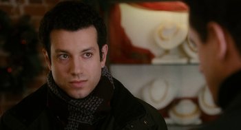 Movie still from “The Family Stone” (2005), directed by Thomas Bezucha – A person wearing a scarf; Close Up shot, Over the shoulder angle