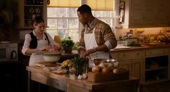 Movie still from “The Family Stone” (2005), directed by Thomas Bezucha – A man and a woman preparing food in a kitchen; Medium shot, High angle