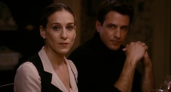 Movie still from “The Family Stone” (2005), directed by Thomas Bezucha – A man and a woman posing for a picture; Close Up shot, Over the shoulder angle