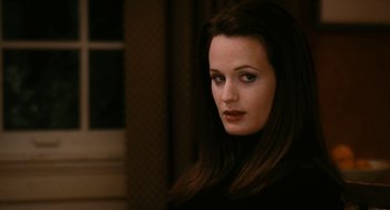 Movie still from “The Family Stone” (2005), directed by Thomas Bezucha – A woman with long dark brown hair wearing a black shirt; Close Up shot, Over the shoulder angle