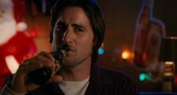 Movie still from “The Family Stone” (2005), directed by Thomas Bezucha – A person drinking a beer; Close Up shot, Low angle