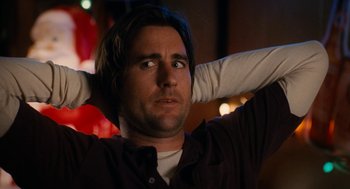 Movie still from “The Family Stone” (2005), directed by Thomas Bezucha – A person with his hands behind his head; Close Up shot, Low angle