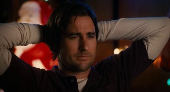 Movie still from “The Family Stone” (2005), directed by Thomas Bezucha – A person holding his hair up; Close Up shot, Low angle