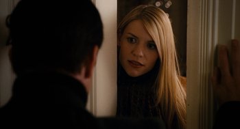 Movie still from “The Family Stone” (2005), directed by Thomas Bezucha – A young blonde haired woman looking into a mirror; Close Up shot, Over the shoulder angle