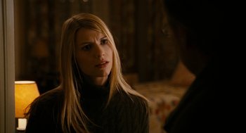 Movie still from “The Family Stone” (2005), directed by Thomas Bezucha – A woman in a black sweater is looking at the camera; Close Up shot, Over the shoulder angle