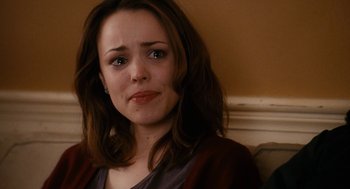 Movie still from “The Family Stone” (2005), directed by Thomas Bezucha – A person sitting on a couch; Close Up shot, Over the shoulder angle