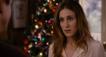 Movie still from “The Family Stone” (2005), directed by Thomas Bezucha – A woman standing in front of a christmas tree; Close Up shot, Over the shoulder angle