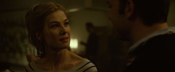 Movie still from “Gone Girl” (2014), directed by David Fincher – A person looking at a camera; Close Up shot, Over the shoulder angle