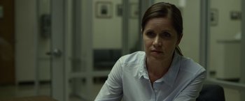 Movie still from “Gone Girl” (2014), directed by David Fincher – A person wearing a white shirt; Close Up shot, Over the shoulder angle