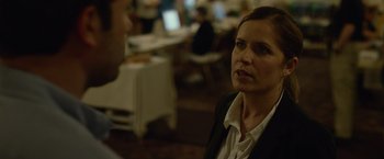 Movie still from “Gone Girl” (2014), directed by David Fincher – A woman is talking to a man in an office setting; Close Up shot, Over the shoulder angle