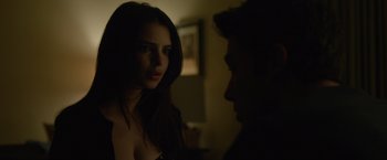 Movie still from “Gone Girl” (2014), directed by David Fincher – A woman standing next to a man in the dark; Close Up shot, Over the shoulder angle