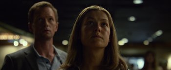 Movie still from “Gone Girl” (2014), directed by David Fincher – A woman looking up at the sky while standing next to a man; Close Up shot, Low angle