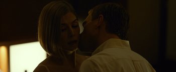 Movie still from “Gone Girl” (2014), directed by David Fincher – A man and a woman kissing in the dark; Close Up shot, Low angle