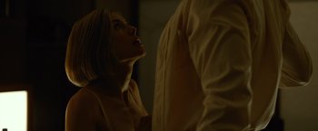 Movie still from “Gone Girl” (2014), directed by David Fincher – A woman looking up into the sky while standing next to a man; Close Up shot, Low angle