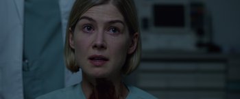 Movie still from “Gone Girl” (2014), directed by David Fincher – A person with blood on her face; Close Up shot, Over the shoulder angle