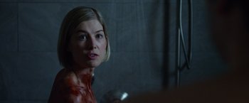 Movie still from “Gone Girl” (2014), directed by David Fincher – A person with blood on her face; Close Up shot, Over the shoulder angle