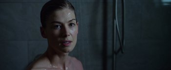 Movie still from “Gone Girl” (2014), directed by David Fincher – A person taking a shower in a room; Close Up shot, Over the shoulder angle