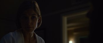 Movie still from “Gone Girl” (2014), directed by David Fincher – A person in a dark room; Close Up shot, Over the shoulder angle