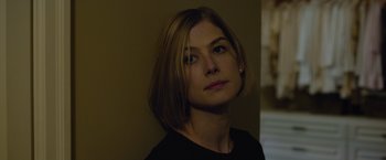 Movie still from “Gone Girl” (2014), directed by David Fincher – A person with short hair; Close Up shot, Over the shoulder angle