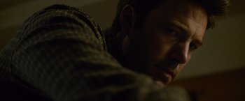 Movie still from “Gone Girl” (2014), directed by David Fincher – A man's face in the dark; Close Up shot, Low angle