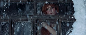 Movie still from “The Fearless Vampire Killers” (1967), directed by Roman Polanski – A woman standing in a window looking out of a window; Close Up shot, Low angle