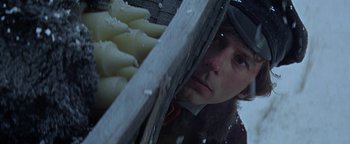 Movie still from “The Fearless Vampire Killers” (1967), directed by Roman Polanski – A man looking through a hole in the roof of a building; Close Up shot, Low angle