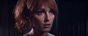 Movie still from “The Fearless Vampire Killers” (1967), directed by Roman Polanski – A woman with red hair; Close Up shot, Low angle