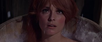 Movie still from “The Fearless Vampire Killers” (1967), directed by Roman Polanski – A person with wet red hair; Close Up shot, Low angle