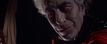Movie still from “The Fearless Vampire Killers” (1967), directed by Roman Polanski – A man's face in a dark room; Close Up shot, Low angle