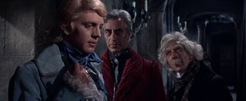 Movie still from “The Fearless Vampire Killers” (1967), directed by Roman Polanski – A group of people standing next to each other in a room; Medium shot, Over the shoulder angle