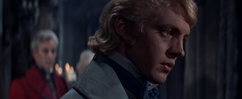 Movie still from “The Fearless Vampire Killers” (1967), directed by Roman Polanski – A person with long blonde hair; Close Up shot, Over the shoulder angle