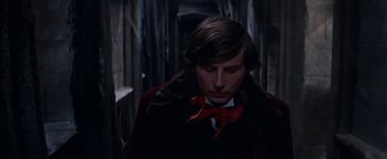 Movie still from “The Fearless Vampire Killers” (1967), directed by Roman Polanski – A man in a red bow tie and a black jacket; Close Up shot, High angle