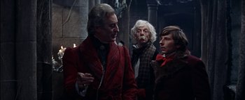 Movie still from “The Fearless Vampire Killers” (1967), directed by Roman Polanski – A group of men standing next to each other in a room; Medium shot, Over the shoulder angle