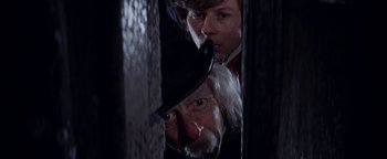 Movie still from “The Fearless Vampire Killers” (1967), directed by Roman Polanski – A man in a top hat looking at a man in a top hat; Close Up shot, Low angle