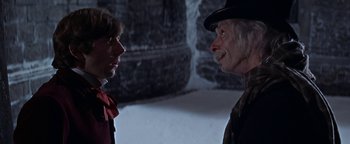 Movie still from “The Fearless Vampire Killers” (1967), directed by Roman Polanski – A man and a woman talking to each other in a dark room; Close Up shot, Over the shoulder angle