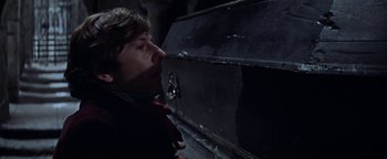 Movie still from “The Fearless Vampire Killers” (1967), directed by Roman Polanski – A man standing in front of an open casket; Close Up shot, High angle