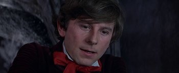 Movie still from “The Fearless Vampire Killers” (1967), directed by Roman Polanski – A young man wearing a red bow tie; Close Up shot, Low angle