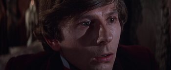 Movie still from “The Fearless Vampire Killers” (1967), directed by Roman Polanski – A man's face in the dark; Close Up shot, Low angle