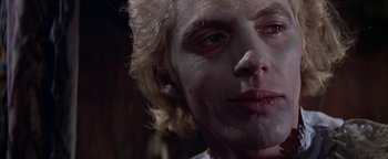 Movie still from “The Fearless Vampire Killers” (1967), directed by Roman Polanski – A man's face in a dark room; Close Up shot, Low angle