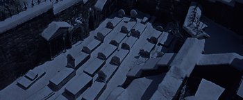 Movie still from “The Fearless Vampire Killers” (1967), directed by Roman Polanski – An aerial view of a group of benches in the snow; Extreme Wide shot, High angle