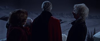 Movie still from “The Fearless Vampire Killers” (1967), directed by Roman Polanski – A group of people standing on top of a hill; Medium shot, Over the shoulder angle