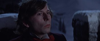 Movie still from “The Fearless Vampire Killers” (1967), directed by Roman Polanski – A person wearing a suit and tie; Close Up shot, Low angle