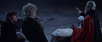 Movie still from “The Fearless Vampire Killers” (1967), directed by Roman Polanski – A man and a woman looking out over a snowy mountain; Medium shot, Over the shoulder angle