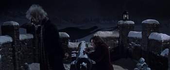 Movie still from “The Fearless Vampire Killers” (1967), directed by Roman Polanski – A woman looking at a cannon in a dark setting; Medium shot, High angle