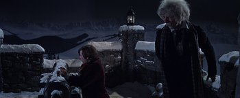 Movie still from “The Fearless Vampire Killers” (1967), directed by Roman Polanski – Two women standing next to each other in front of a building; Wide shot, Low angle