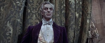 Movie still from “The Fearless Vampire Killers” (1967), directed by Roman Polanski – A person wearing a suit and bow tie; Medium shot, Low angle