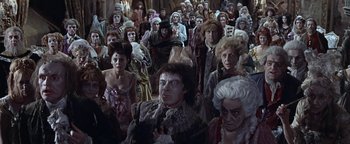 Movie still from “The Fearless Vampire Killers” (1967), directed by Roman Polanski – A group of people dressed up in costumes; Wide shot, High angle