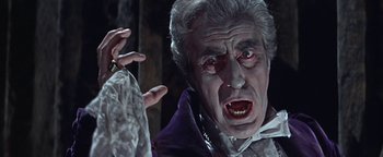 Movie still from “The Fearless Vampire Killers” (1967), directed by Roman Polanski – An old man dressed as a vampire is holding his hand up; Close Up shot, Low angle